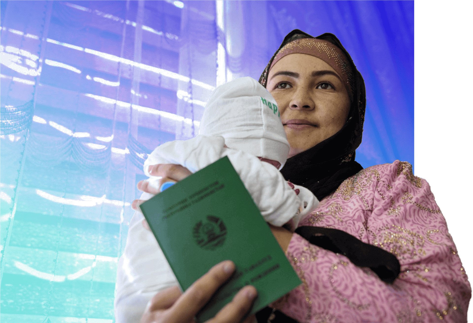 woman with headscarf holding her baby and ID